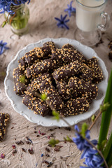 Chocolate biscuit. Crispy and crumbly delicious cookies with natural ingredients: flour, nuts, seeds, pieces of chocolate, cocoa, fruit jams.
