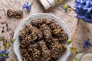 Chocolate biscuit. Crispy and crumbly delicious cookies with natural ingredients: flour, nuts, seeds, pieces of chocolate, cocoa, fruit jams.