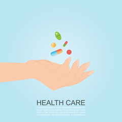 Womans hand holding colorful medicines pills capsules.