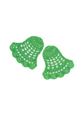 The bells are crocheted with green threads. Isolated on white background. Top view. Holiday decor.