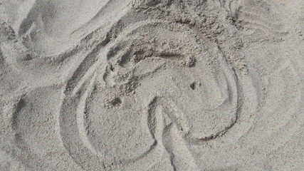 Fototapeta na wymiar face and sand