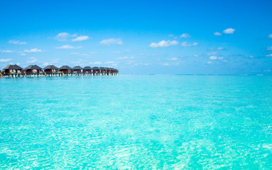 Plakat beach with water bungalows at Maldives