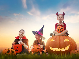 kids in Halloween carnival costumes