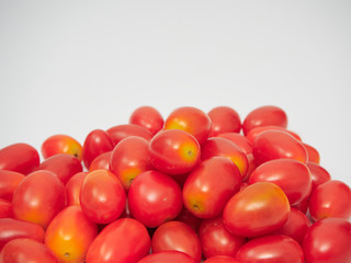 Fresh cherry tomatoes on white background