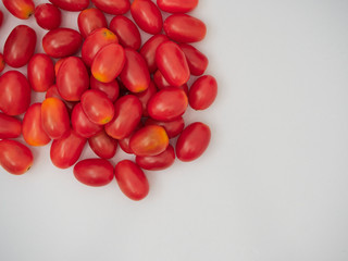 Fresh cherry tomatoes on white background