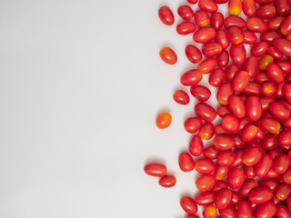 Fresh cherry tomatoes on white background