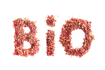 Food typography word Bio made of dried rose petals. Clean and healthy eating concept. Isolated on white background