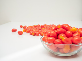 Fresh tomatoes in a glass bowl