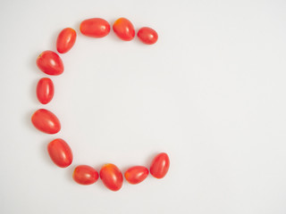 Fresh cherry tomatoes on white background
