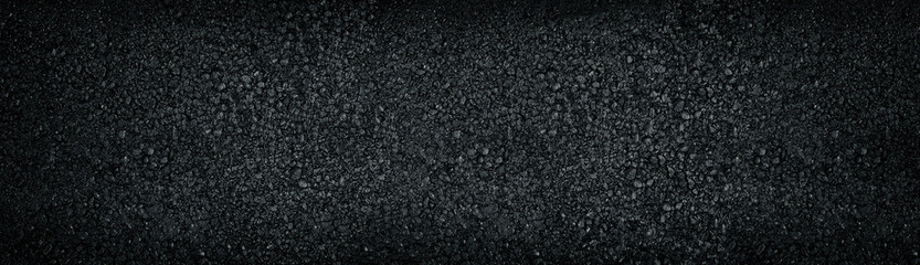 Wide black textured background. Shiny glossy dark panoramic surface