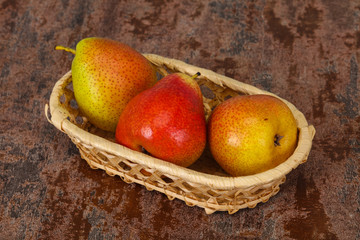 Pear heap in the wooden basket