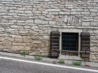 windows and doors of a building in a mountain village of Italy