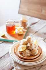 Healthy raw vegan candies with coconut and lemon, concept of tasty vegetarian food