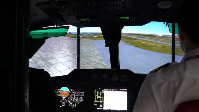 Helicopter pilots train on a computer simulator helicopter