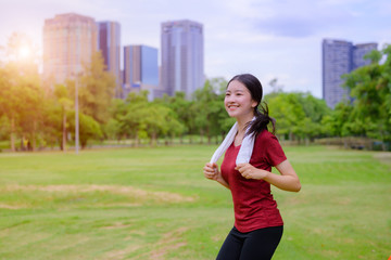 healthy woman jogging daily morning, exercise in city park alone