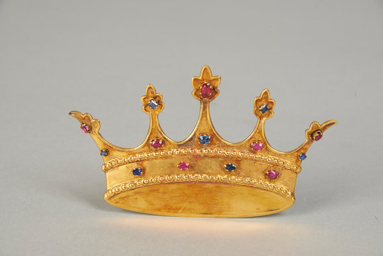 gold crown on grey background