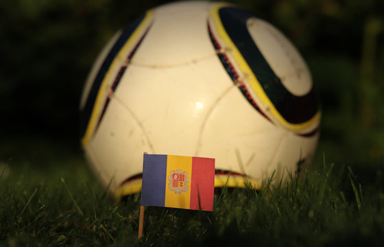 Andorra national flag on wooden stick stabbed in playground. World Championship 2022. Euro 2020. International friendly match. Blue, yellow and red paper