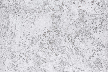 Wall covered with decorative plaster imitating bark beetle. Close-up, copy space