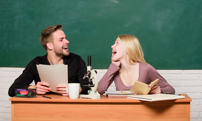 Studying together is fun. Student life. Lesson and blackboard. Teachers day. Back to school. Modern school. Knowledge day. Couple of man and woman in classroom. Home schooling. Happy couple