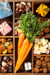 Beautiful St. Nicholas Day Greeting Card. Dutch holiday Sinterklaas flat lay with gifts, pepernoten, traditional sweets strooigoed in wooden box.