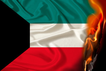 orange flames and ashes on a colored burning national flag of the state, concept of danger, revolution, war, coup, destruction, fires in the country, close-up