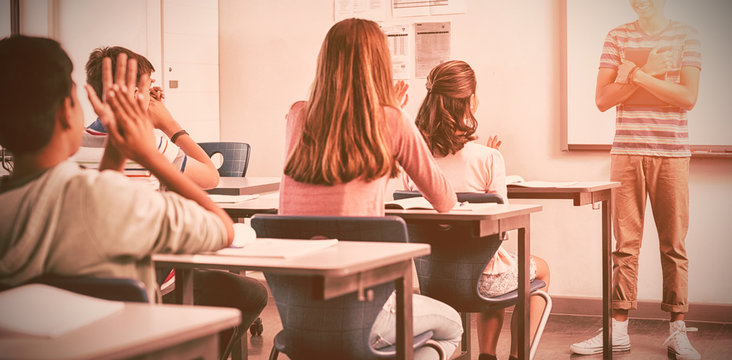 Schoolboy Giving Presentation In Classroom