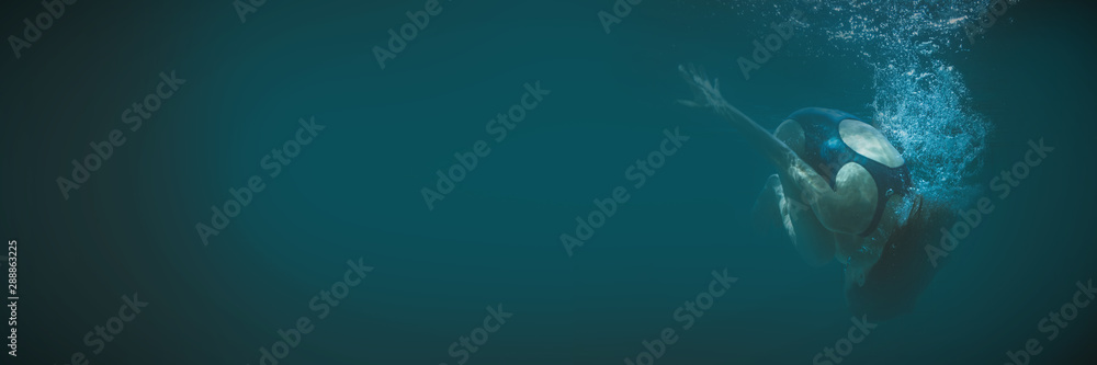 Canvas Prints athletic swimmer doing a somersault underwater