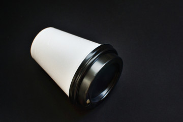 Coffee paper cup with black lid, pick up paper cup.