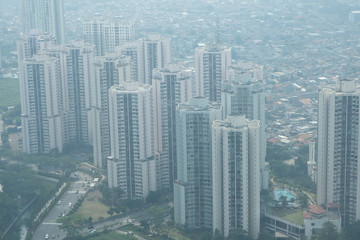 Obraz premium Smog dust air pollution in city of Jakarta, Indonesia