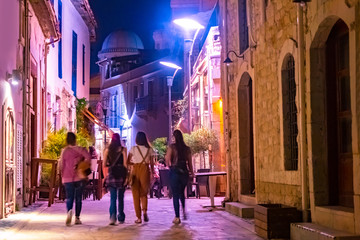 Night Limassol. Cyprus. Walking the streets of Limassol. Tours of the city of Limassol. People walk around night Cyprus. Sights of Cyprus. Walking through the night streets. Mediterranean seacoast.