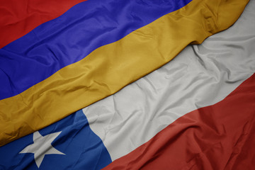 waving colorful flag of chile and national flag of armenia.