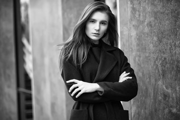 Fototapeta premium Girl in a coat black and white photo