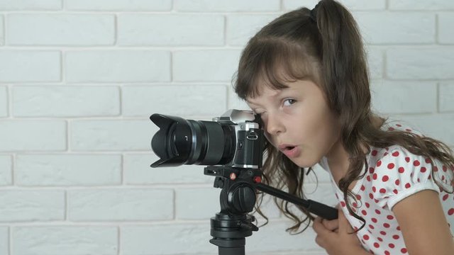 Young videographer. Child take video.