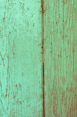Fototapeta na wymiar Wooden panels and boards of a rural house, Italy. Walls and ornaments in painted wood for the country house, ruined by time.