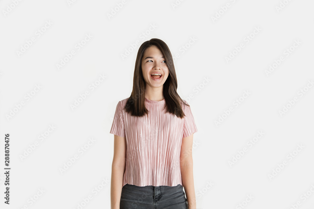 Wall mural Beautiful female half-length portrait isolated on white studio background. Young emotional woman in casual clothes. Human emotions, facial expression concept. Crazy happy, screaming, laughting. - Wall murals