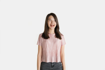 Fototapeta premium Beautiful female half-length portrait isolated on white studio background. Young emotional woman in casual clothes. Human emotions, facial expression concept. Crazy happy, screaming, laughting.
