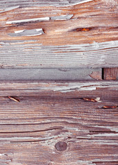 Wooden panels and boards of a rural house, Italy. Walls and ornaments in painted wood for the country house, ruined by time.