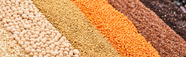 panoramic shot of assorted whole grains and chickpea