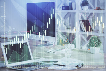 Double exposure of graph and financial info and work space with computer background. Concept of international online trading.