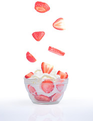 Bowl of strawberries with cream.