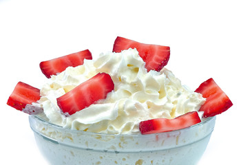 Bowl of strawberries with cream.
