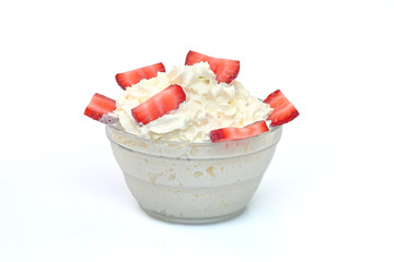 Bowl of strawberries with cream.