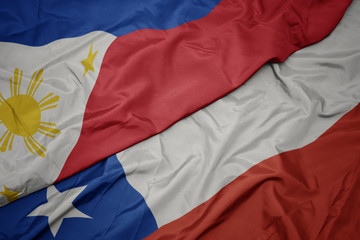 waving colorful flag of chile and national flag of philippines.