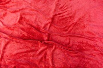 Orange folded blanket, texture color