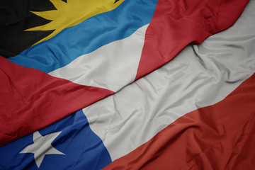 waving colorful flag of chile and national flag of antigua and barbuda.