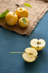 Sliced yellow apple on a blue background