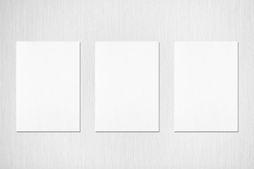 Three empty white vertical rectangle poster or card mockups