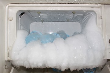 The fridge has a problem with a freezer that has a lot of ice