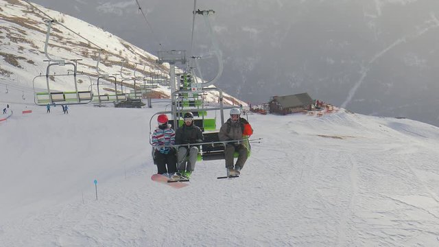 Skilift used by a group of young skier friends