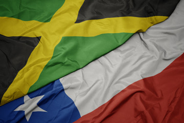 waving colorful flag of chile and national flag of jamaica.